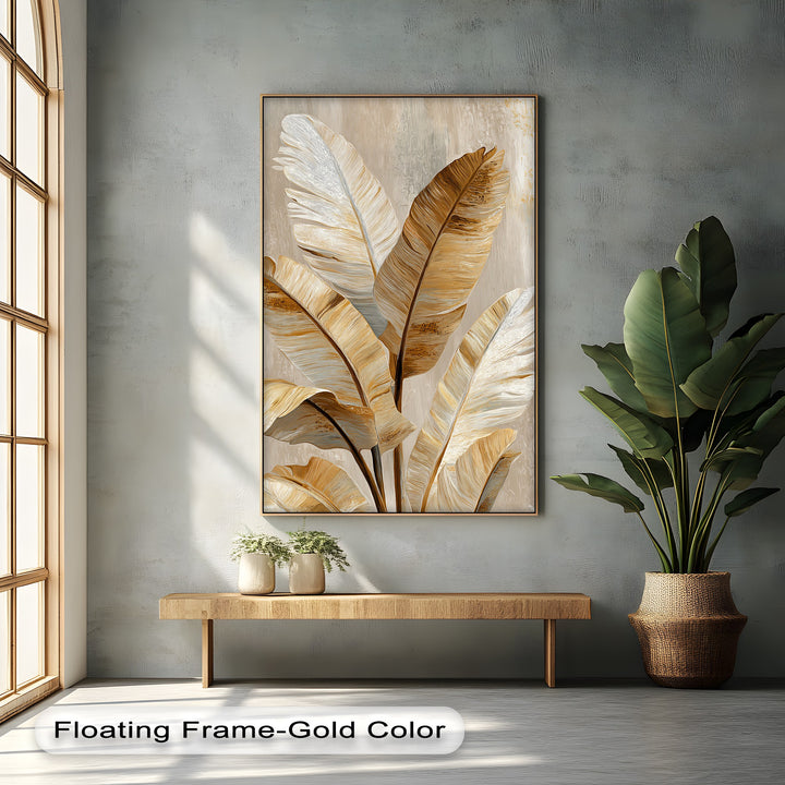 Bathed in sunlight, the golden tropical leaf canvas print showcases bright, elegant areas highlighting the neutral botanical design as a piece of canvas wall decor.
