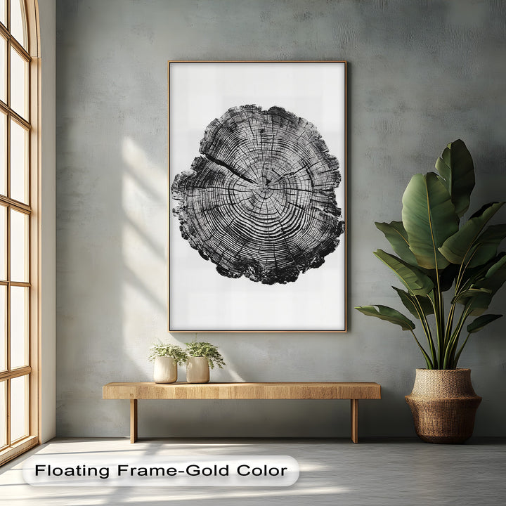 Finished with a floating gold frame, this monochrome tree ring art is a unique canvas print that elevates minimalist wood grain wall art.