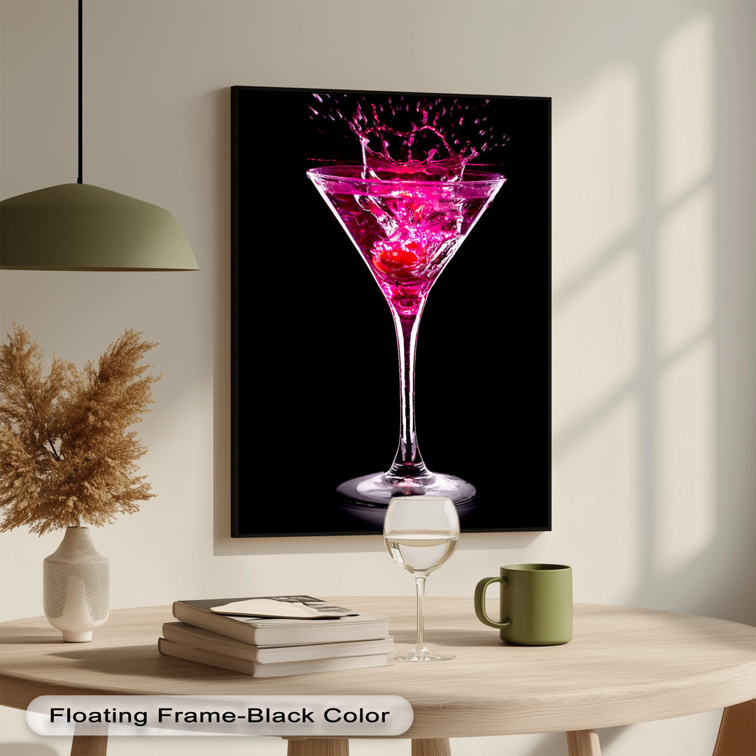 A vertically oriented rectangular framed canvas showcases a vibrant pink martini cocktail with a glamorous splash.