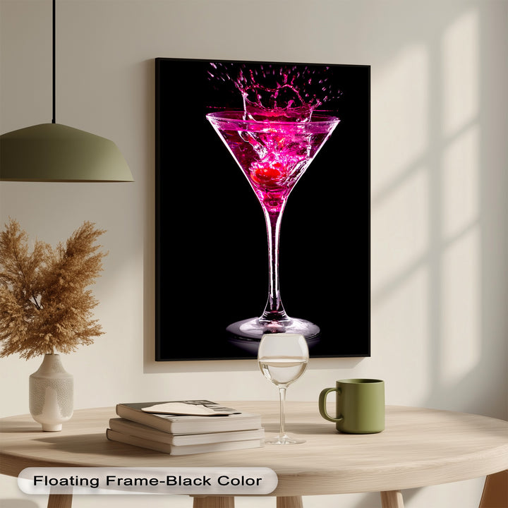 A vertically oriented rectangular framed canvas showcases a vibrant pink martini cocktail with a glamorous splash.