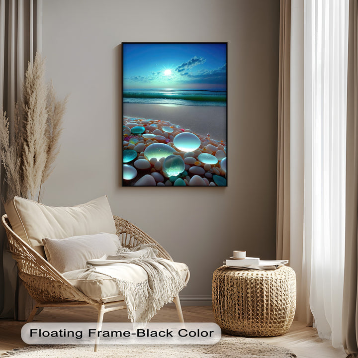 Sleek black borders accentuate the vibrant big canvas prints of a glowing pebble beach at sunset, featuring radiant light and serene ocean waves.