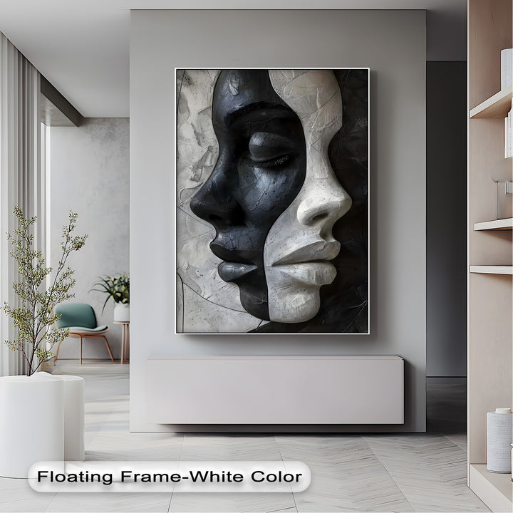 The textured surface of the Contrasting Faces, high quality canvas prints, features sculptural black and white abstract faces.
