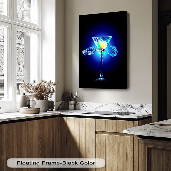 The striking illumination of the blue martini canvas art casts subtle shadows, highlighting the vibrant splash and neon glow against the dark background.