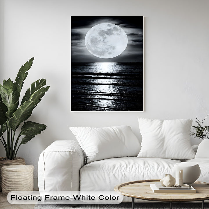 The foreground details, including a pristine white sofa with pillows and a wooden coffee table, beautifully complementing the big canvas prints.