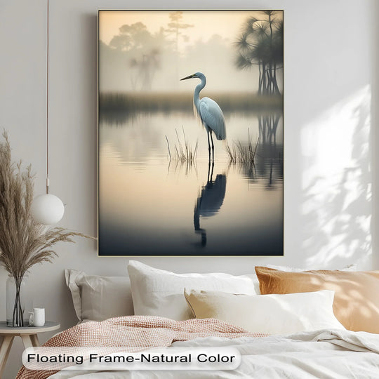 Mist rising over the misty morning lake behind the heron creates a serene backdrop in this lakeside reflection framed canvas print.