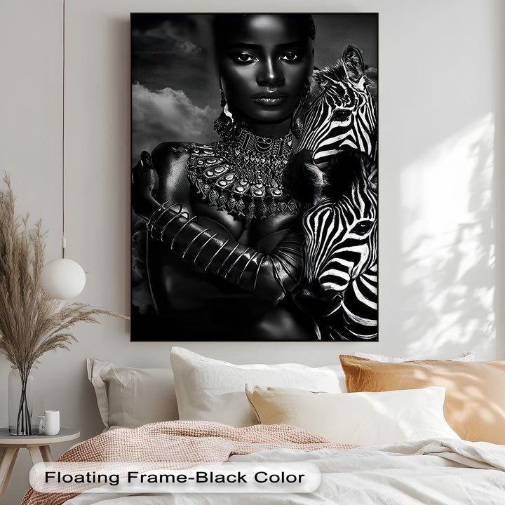 The dramatic interplay of light and shadow defines this monochrome zebra canvas wall art, portraying an elegant woman with a striking zebra.