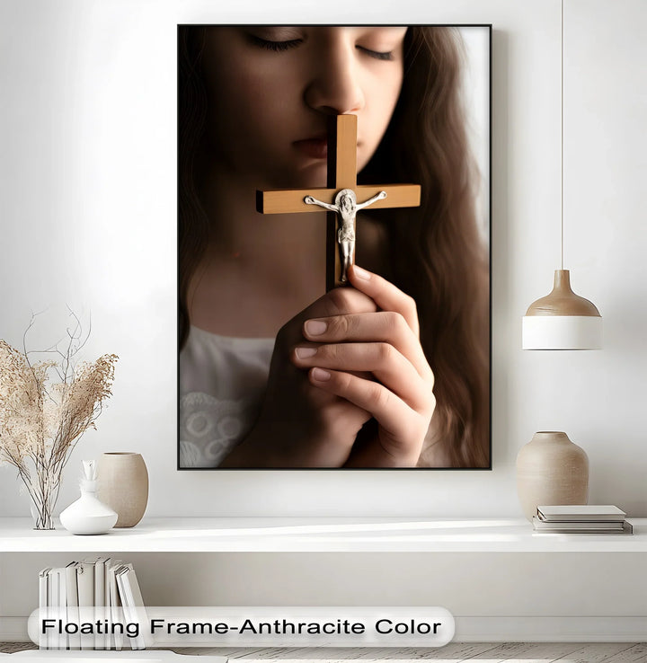 Faithful Prayer – Girl Holding Crucifix Close-Up Canvas Print