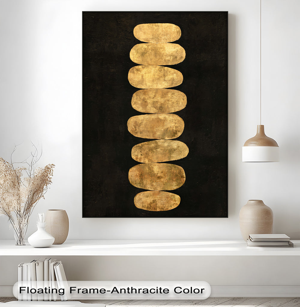 High color contrast accentuates the golden balance stones in this minimalist zen canvas painting against a dark backdrop.