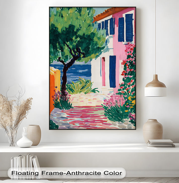 Realistic detail showcases the vibrant coastal garden wall art as a colorful Mediterranean village canvas pictures print with a seaside house and flowers.