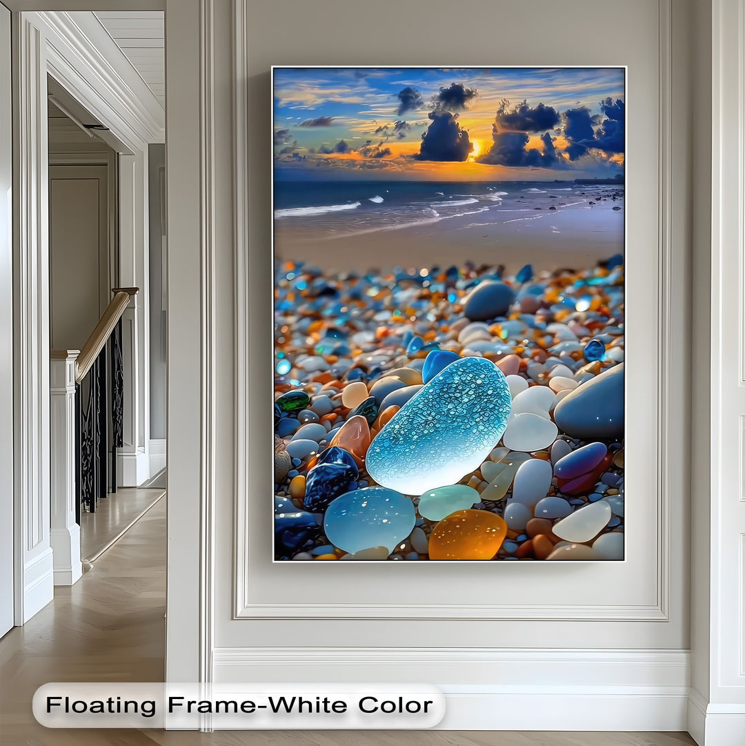 This vertical, rectangular canvas wall decor presents a vibrant sea glass beach under a breathtaking coastal sunset.