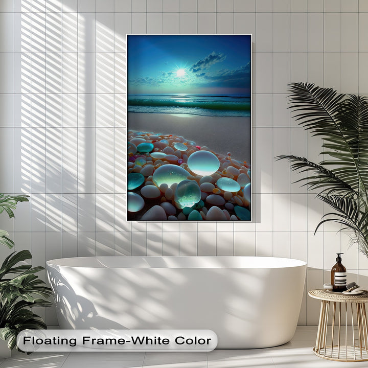 The cool color temperature of this big canvas print highlights an ethereal glowing pebble beach beneath a vibrant azure coastal sunset.