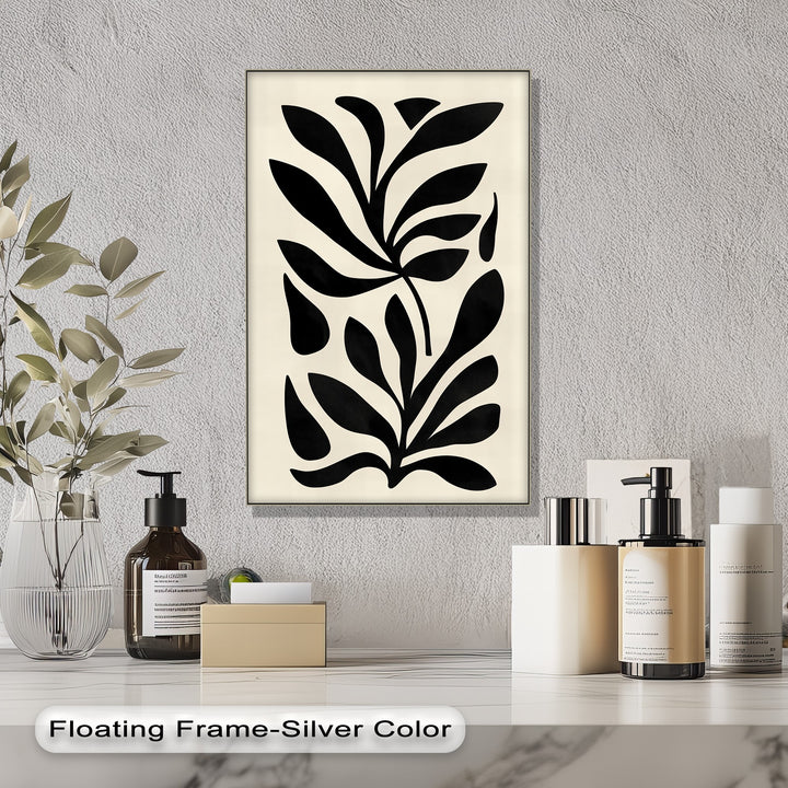 Showing the realistic detail of the minimalist black botanical canvas print, this modern abstract leaf canvas wall decor features crisp monochrome shapes and a sleek silver floating frame.