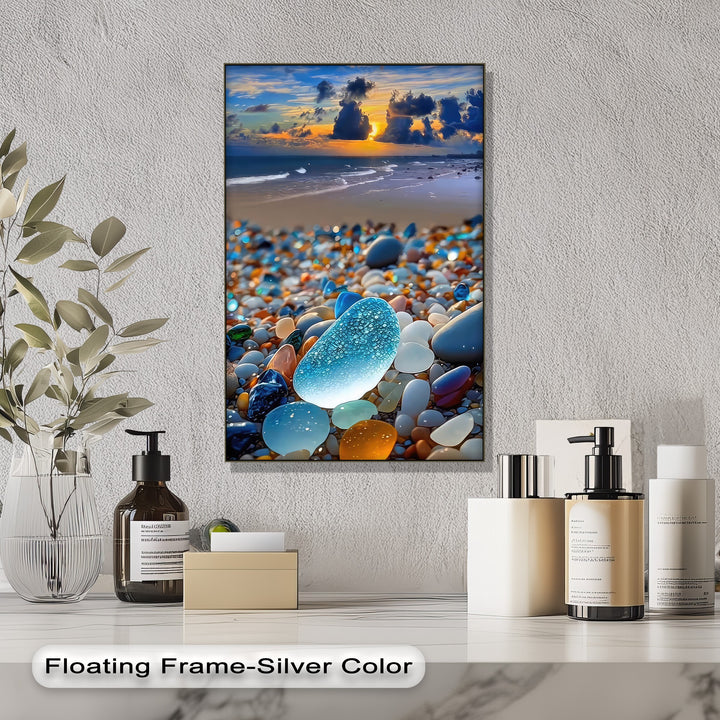 Glowing blue sea glass shines among vibrant beach pebbles, ocean waves, and a coastal sunset on this beautiful canvas art.