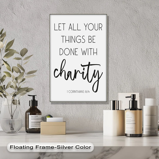 Textured grey wall serves as the background for the 'Let All Things Be Done with Charity' unique canvas print.