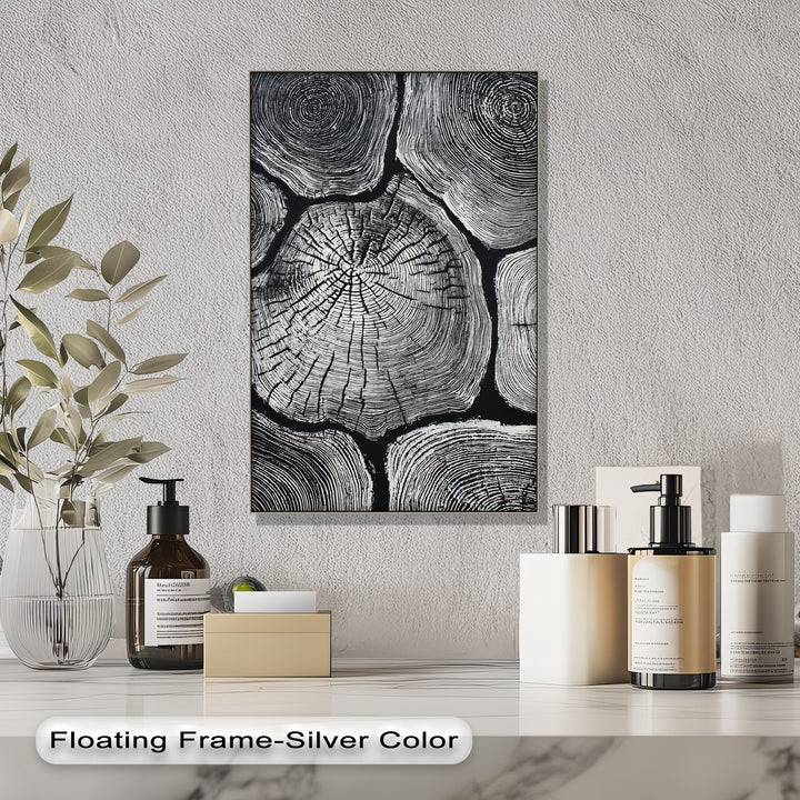 The brightest area highlights the textured detail within this black and white wood grain design, a unique canvas print showcasing minimalist tree ring wall art.