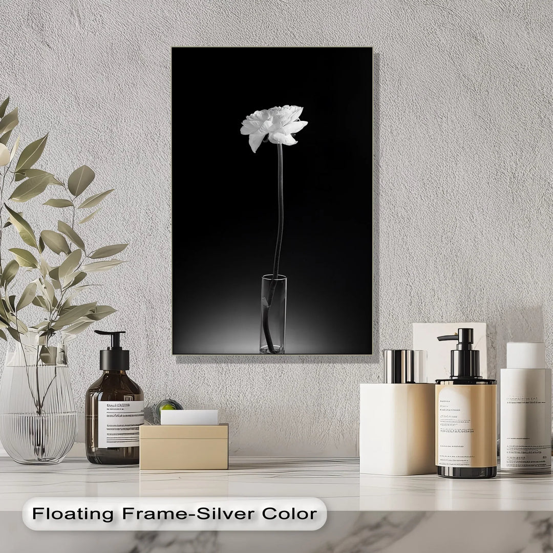 Add peaceful beauty to your space with this tall, monochrome canvas print of a blooming flower.

