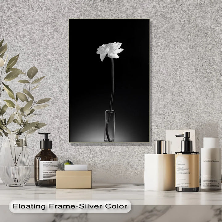 Add peaceful beauty to your space with this tall, monochrome canvas print of a blooming flower.

