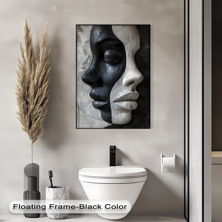 Highlighting the layering effect, this abstract black and white canvas artwork presents two sculptural faces, one dark and one light, in overlap.