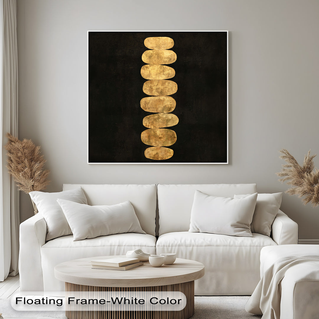 Featuring geometric elements, this minimalist zen canvas wall art showcases a column of golden balance stones against a dark backdrop, printed on canvas.