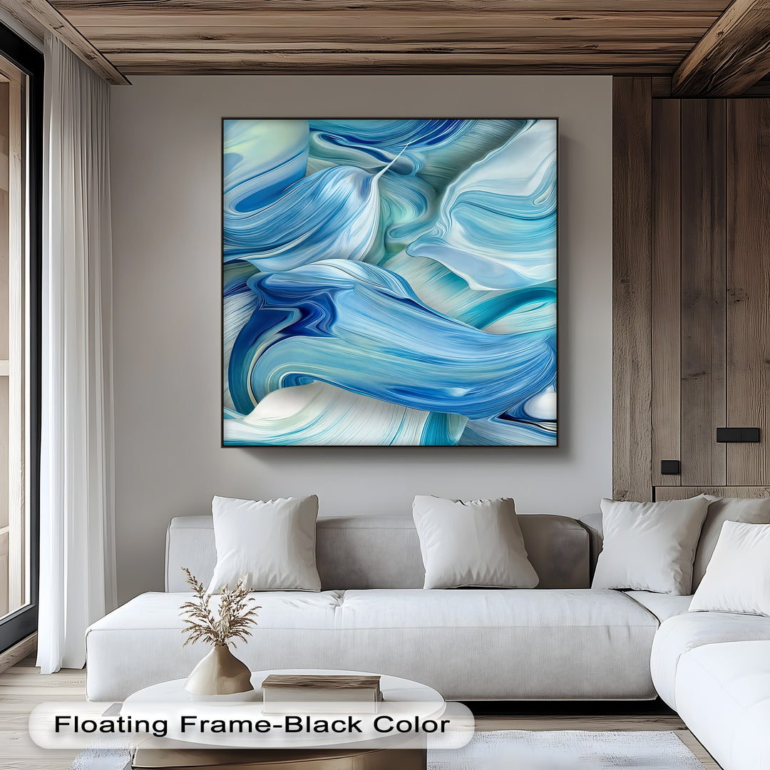 A calm and modern mood fills the room, accentuated by the serene canvas artwork featuring abstract blue and white flowing ocean wave patterns.