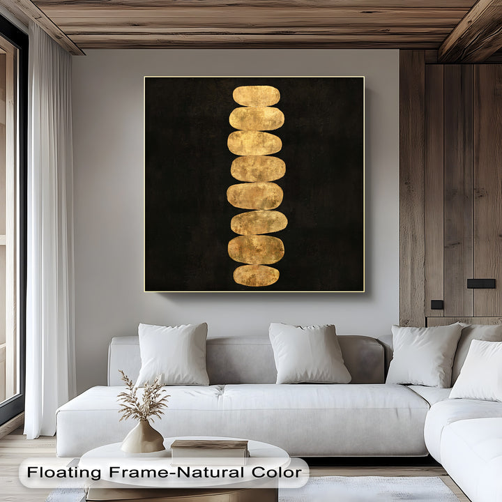 Featuring warm color temperatures, the golden balance stones canvas pictures art print offers a minimalist zen style with stacked stones on a black background.