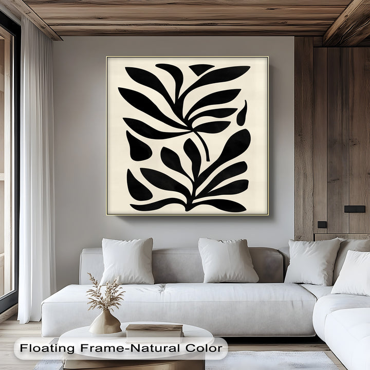 Displaying the organic forms, this minimalist black botanical canvas print features abstract leaf shapes, a modern framed canvas art piece perfect for adding natural elegance.