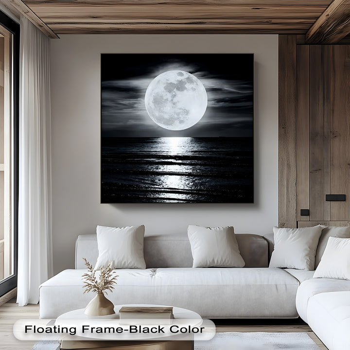 Striking color contrast in this moonlit ocean canvas art print, with the luminous full moon reflecting on the dark, ebony waves.