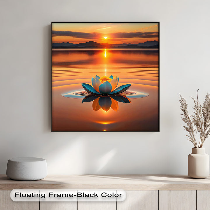 Observe the captivating transition from a fiery orange sunset to its tranquil water reflection on this framed canvas, enhancing a serene blue lotus.