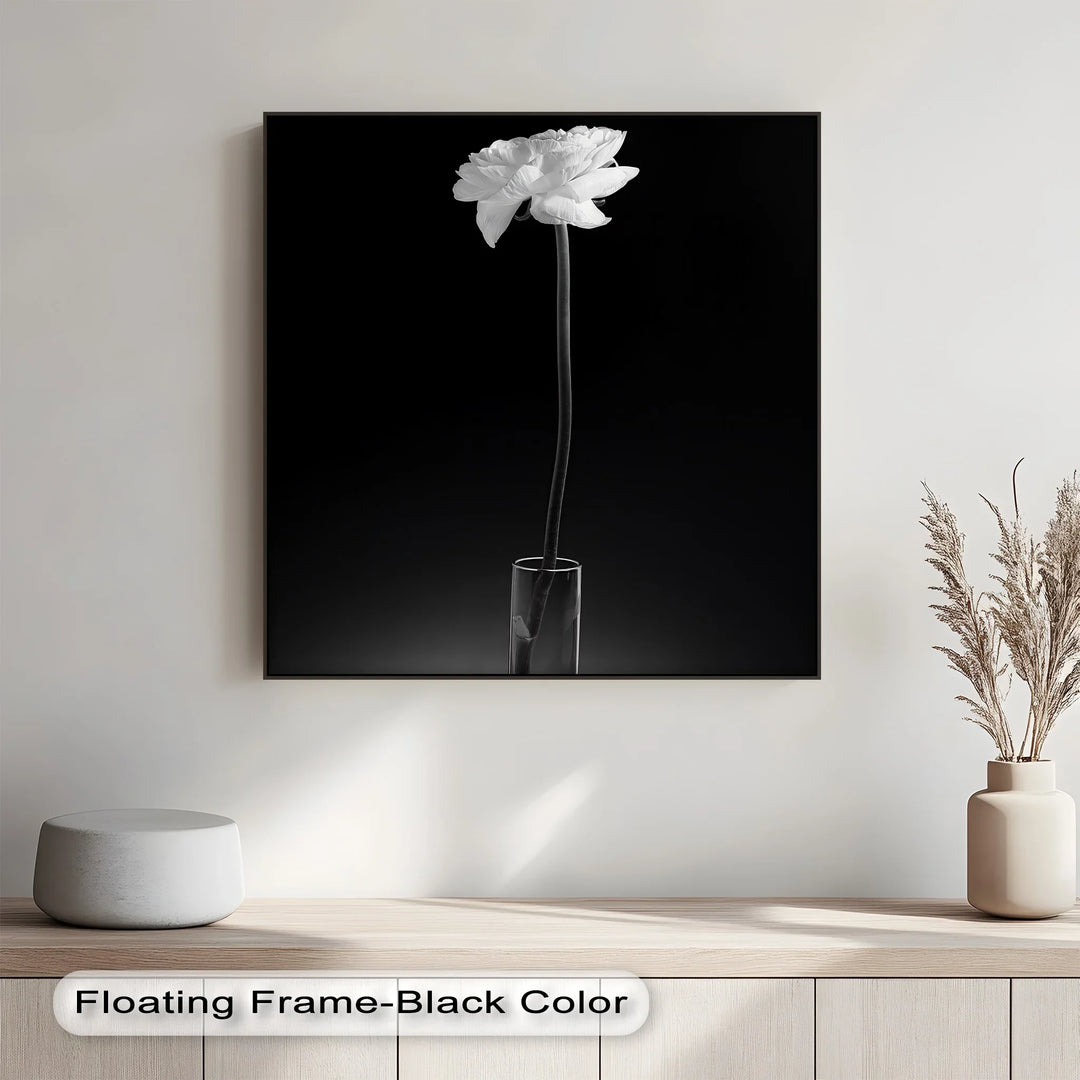 This delicate photo canvas captures quiet sophistication with a solitary bloom in grayscale perfection.

