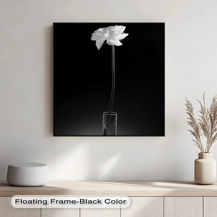 This delicate photo canvas captures quiet sophistication with a solitary bloom in grayscale perfection.

