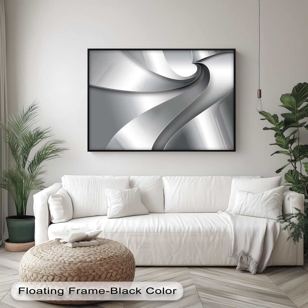 The smooth, reflective finish of the Silver Flow Minimalist Abstract canvas wall art shines within its elegant black floating frame.
