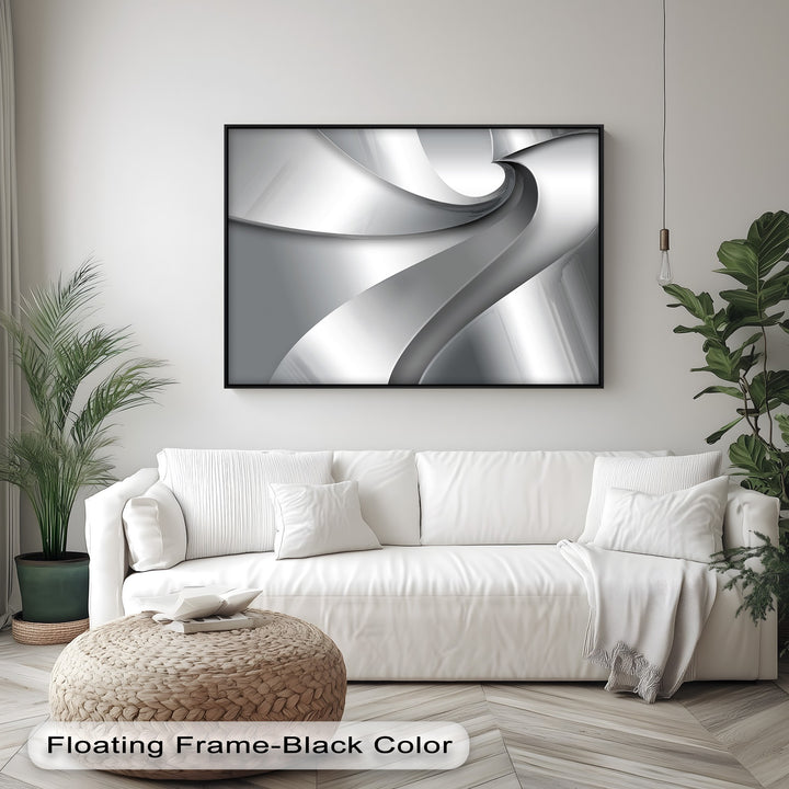 The smooth, reflective finish of the Silver Flow Minimalist Abstract canvas wall art shines within its elegant black floating frame.