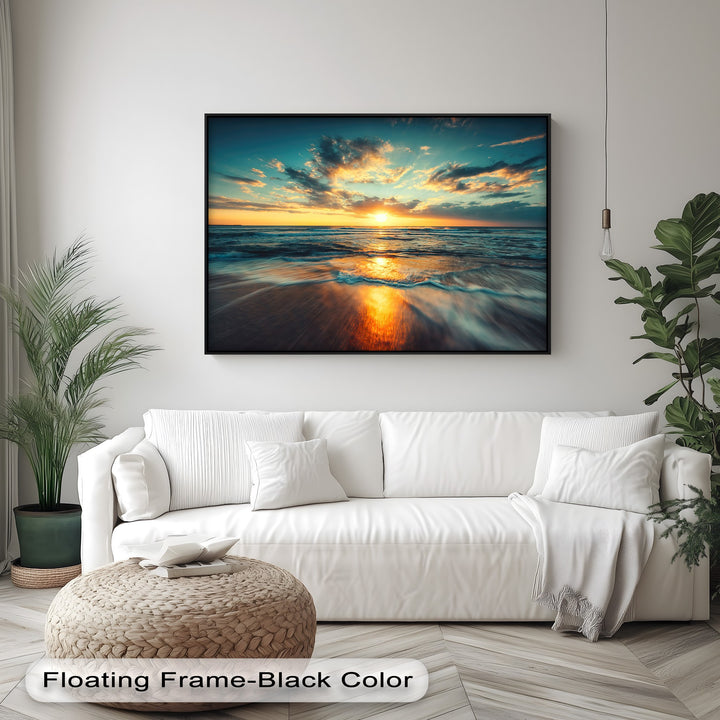 The warm color temperature of this canvas wall decor showcases a radiant golden ocean sunset reflecting fiery hues on the wet sand.