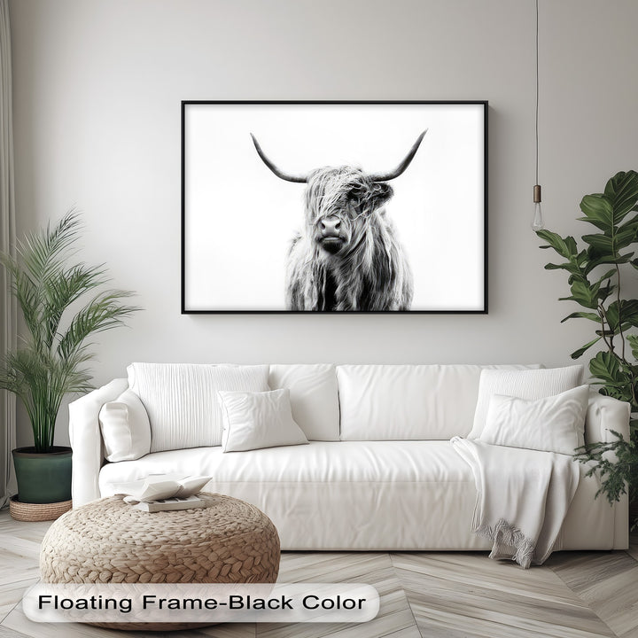 The realistic detail of the shaggy Highland cow with its prominent horns is captured beautifully in this minimalist canvas wall decor.