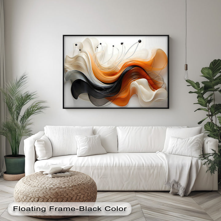Vibrant orange and black flowing abstract ribbons with cream accents form a striking hanging canvas, elegantly framed in black.