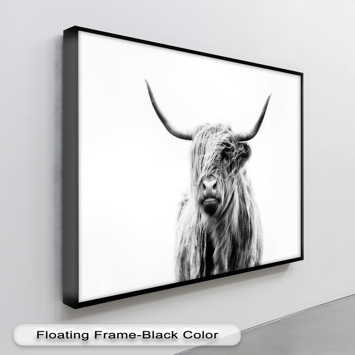 A captivating abstract quality defines this hanging canvas of a shaggy Highland cow, its stark black and white forms revealing expressive textures.