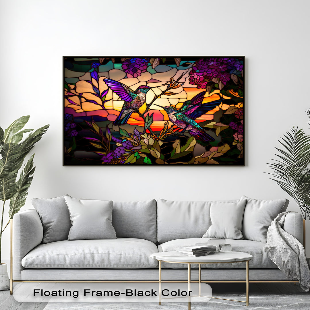 The realistic detail of this big canvas prints piece showcases two vibrant hummingbirds amidst intricate stained glass floral art and a radiant sunset.
