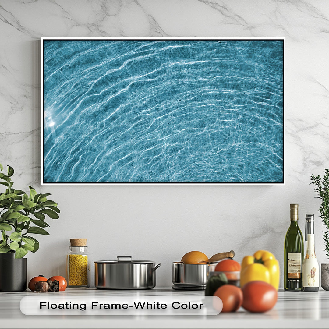 A high-quality big canvas prints of azure water ripples, capturing shimmering light and vivid textures, expertly framed in white.