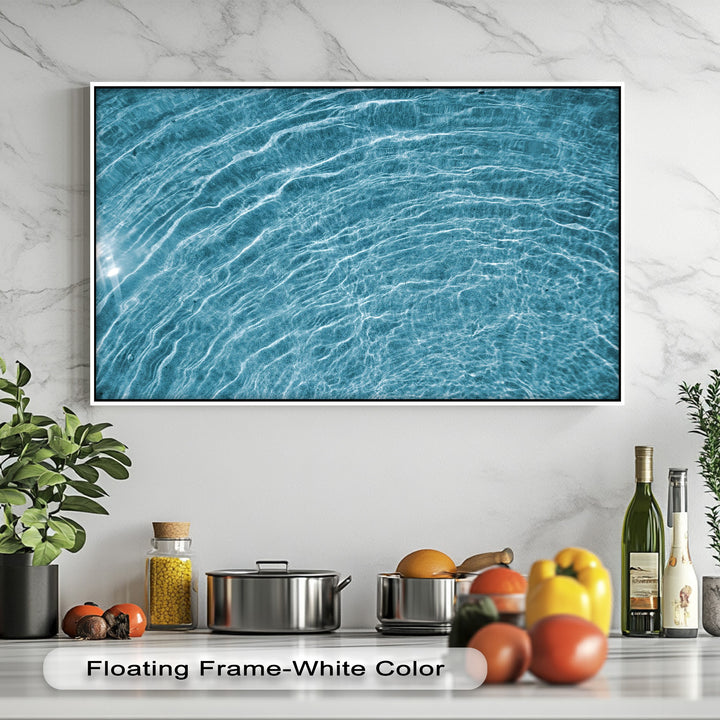 A high-quality big canvas prints of azure water ripples, capturing shimmering light and vivid textures, expertly framed in white.