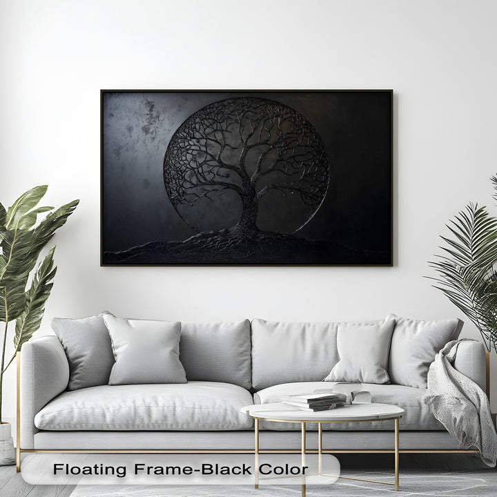 The color contrast is striking with a dark black tree of life big canvas print, featuring sculptural roots, standing out against a bright white wall.