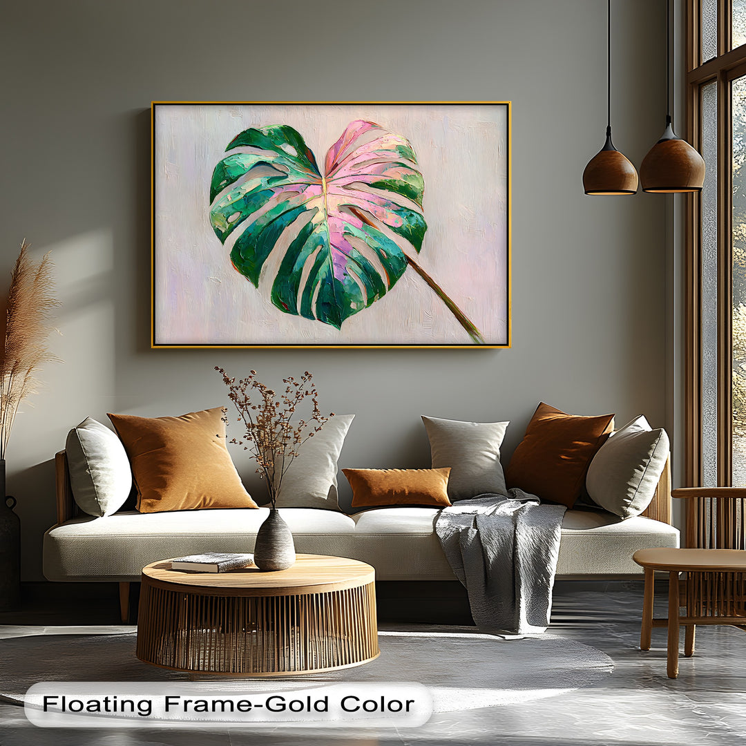 Warm light illuminates the pink monstera leaf canvas wall decor, contrasting with cooler shadows on the textured, modern botanical print.