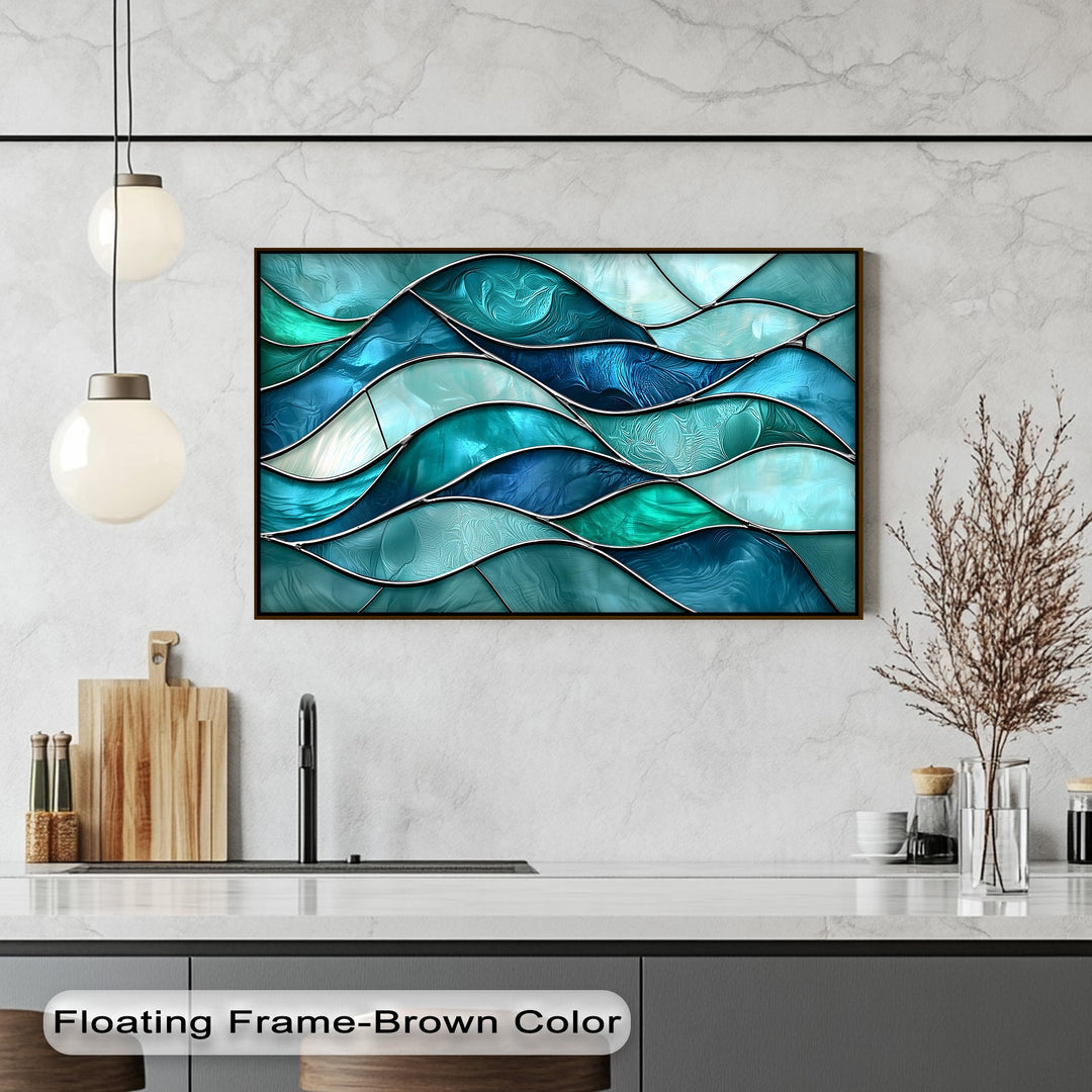 The light marble wall and white kitchen counter provide ample negative space around the framed turquoise wave stained glass ocean canvas art prints.