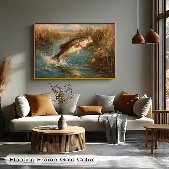 Splashing water highlights the jumping bass of this wildlife fishing hanging canvas print, framed in gold above a neutral sofa in a sunlit room.