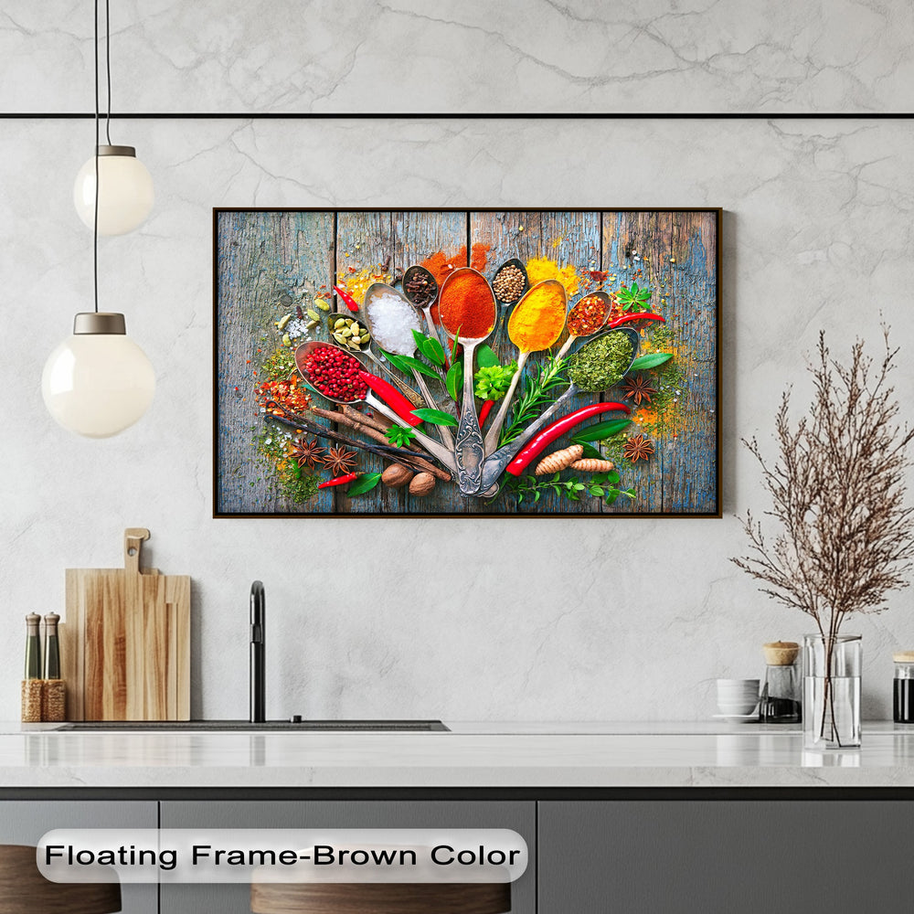 The sleek black sink and rustic wooden cutting board on a white marble countertop perfectly complement the vibrant spice spoons canvas art.