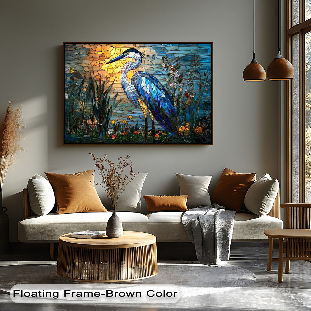 The radiant golden hues of the sunset illuminate the exquisite stained glass heron canvas wall art, highlighting the bird's vibrant blue plumage.