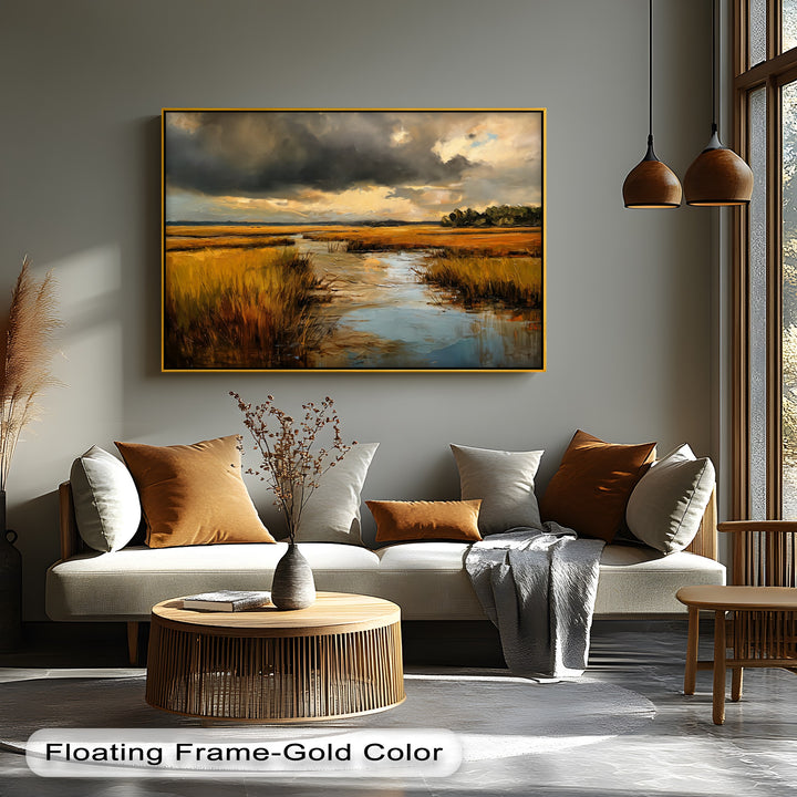 Warm tones dominate this high quality canvas prints of a golden marsh landscape with a dramatic sky, contrasting with the cool tones of water.