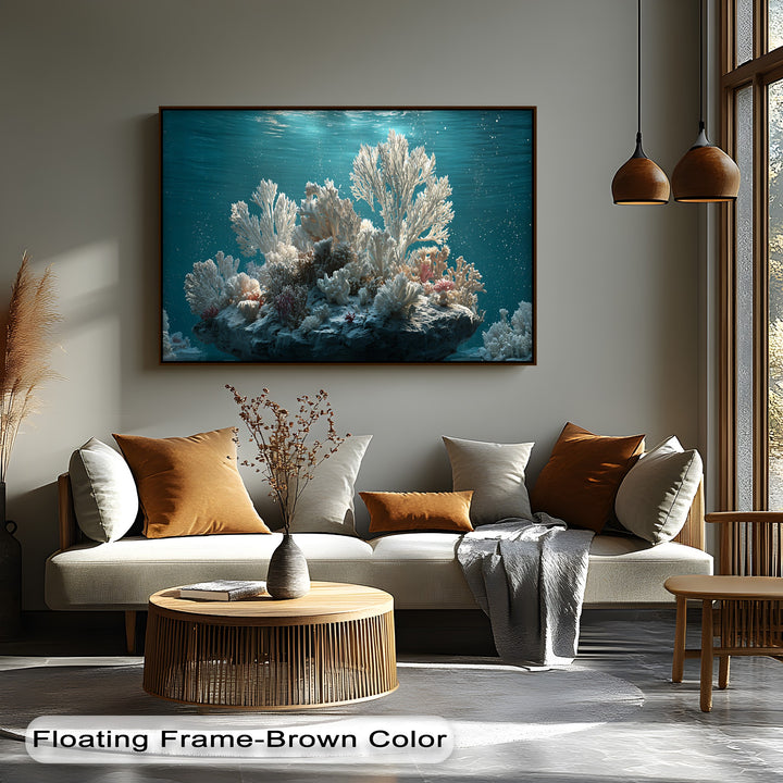 The cool color temperature of the vibrant white coral reef underwater hanging canvas beautifully contrasts with the warm, sunlit room's decor.