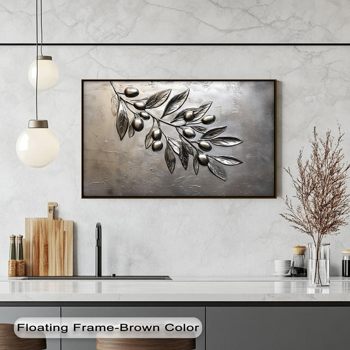 The transition from lustrous metallic silver of the olive branch to the deep textured gray background defines this elegant canvas wall art.