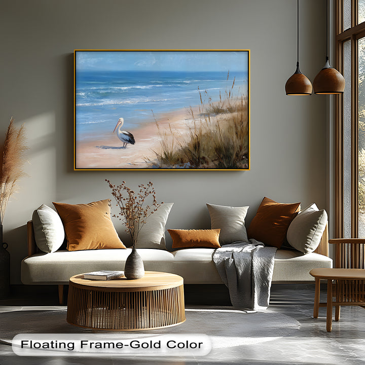 Featuring a gold-colored floating frame, this coastal pelican beach scene is presented as beautiful canvas wall decor, accentuating the edges of the serene ocean wildlife art.