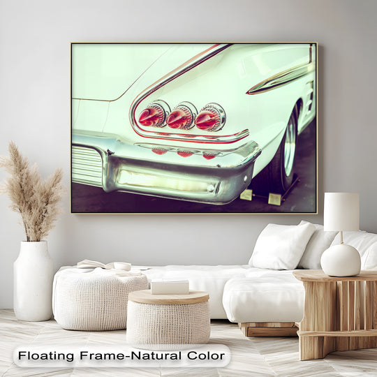 Crafted with premium canvas decor, this 'Tail Light Royalty' canvas print showcases the high-quality material and sharp detail of a classic car's chrome fins.